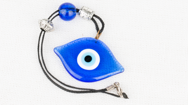 A broken Evil Eye amulet, symbolizing the absorption of negative energy.