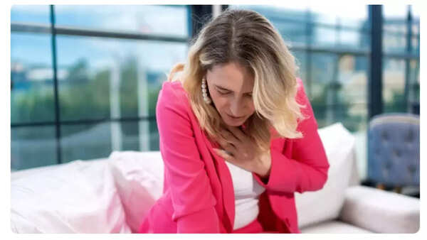 Man clutching chest in pain