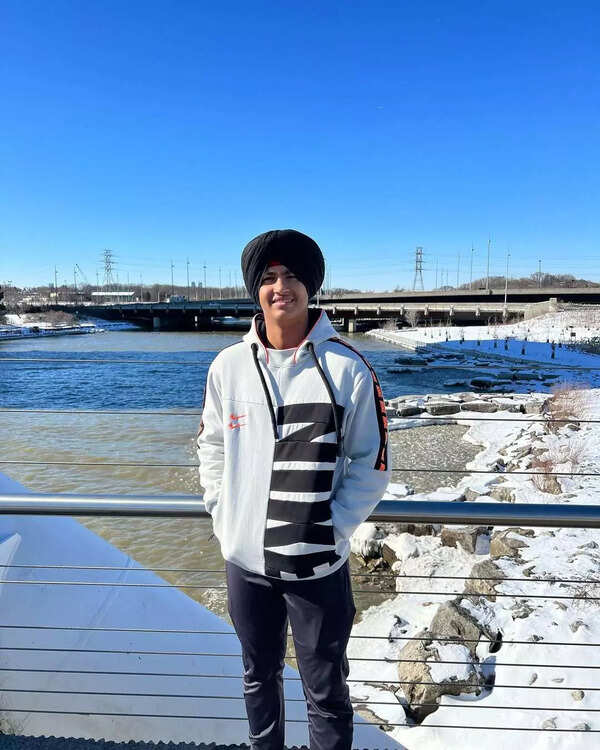 Indian U-19 cricketer Harvansh Singh with his father in Canada.