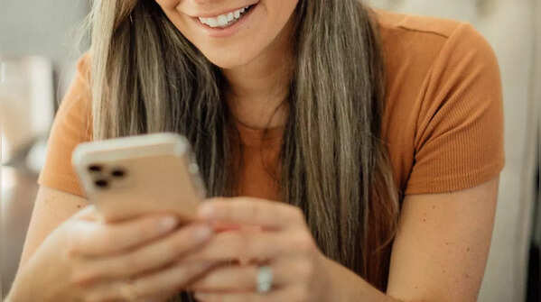 Scrolling with one thumb using both hands signifies thoughtfulness
