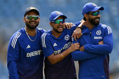 Kuldeep Yadav in discussion with teammates.